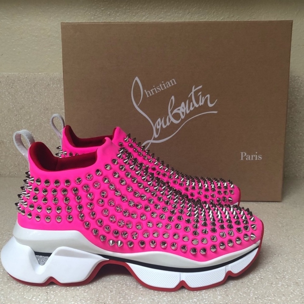 Pink spike louboutin sneakers